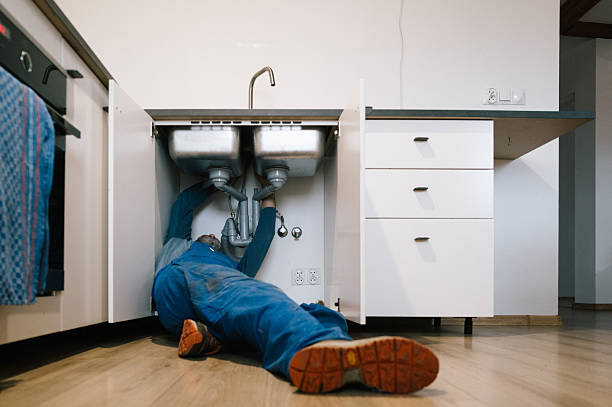 Professional Emergency Plumber technician working in Chartley, MA